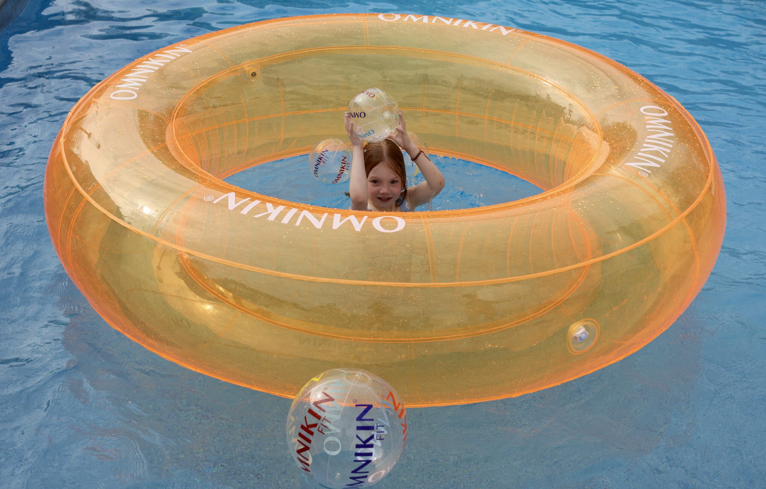 omnikin giant tube with 1 kid in pool